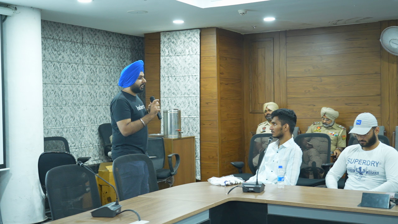 Conference room full of attendees during Q&A session at hacker meetup